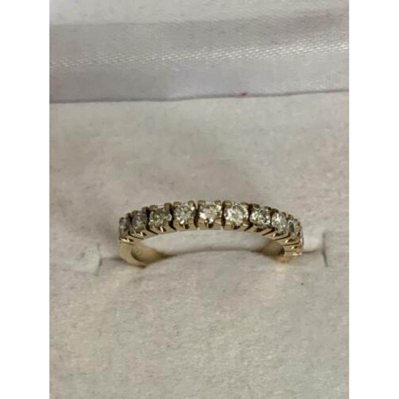 18 krt.geel gouden rijring met 11 diamanten totaal 0,56 ct
