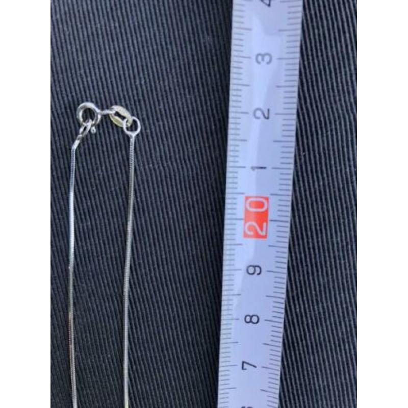 Zilveren ketting met ‘schitterende’ zon / ster hanger