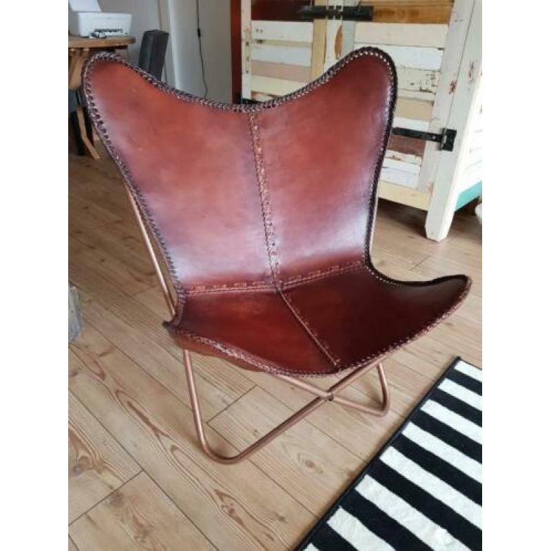 Vlinderstoel van merk Kare design. Mooi dik leer.