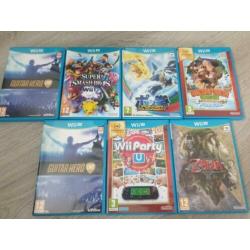 Nintendo wii u + 3 extra controller 2 guitarcontr + 7 games