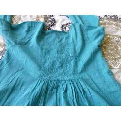 Groene tuniek, lange mouw, maat 158.
