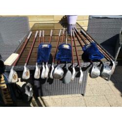 Golfstokken en karretje met tas