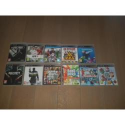 Playstation 3 met 2 controllers en gitaar